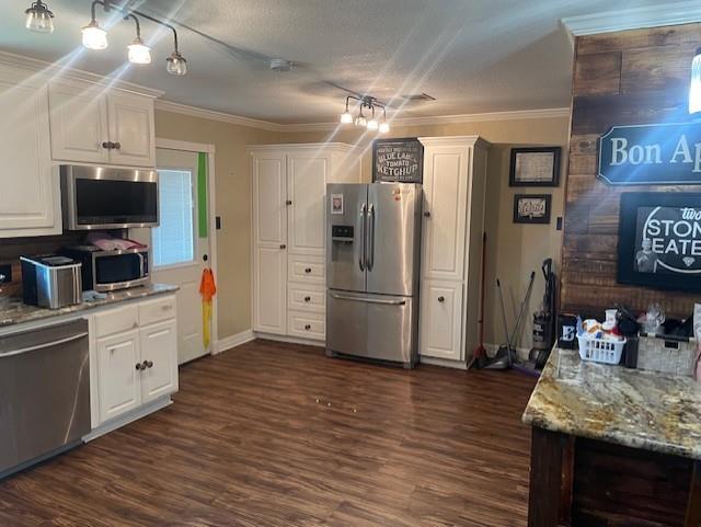 130 Castleman Circle Hewitt, TX 76643 - Photo 11 of 13 a kitchen with stainless steel appliances kitchen island granite countertop a refrigerator and a stove top oven