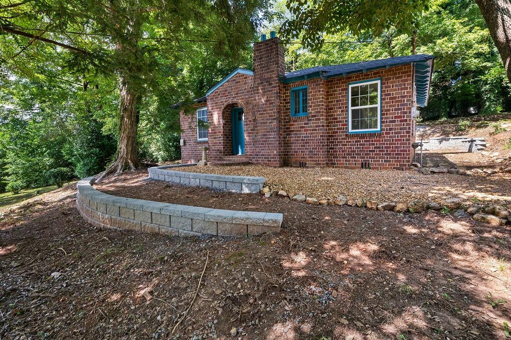 203 Church Street Northeast Rome, GA 30161 - Photo 31 of 40 a front view of a house with garden