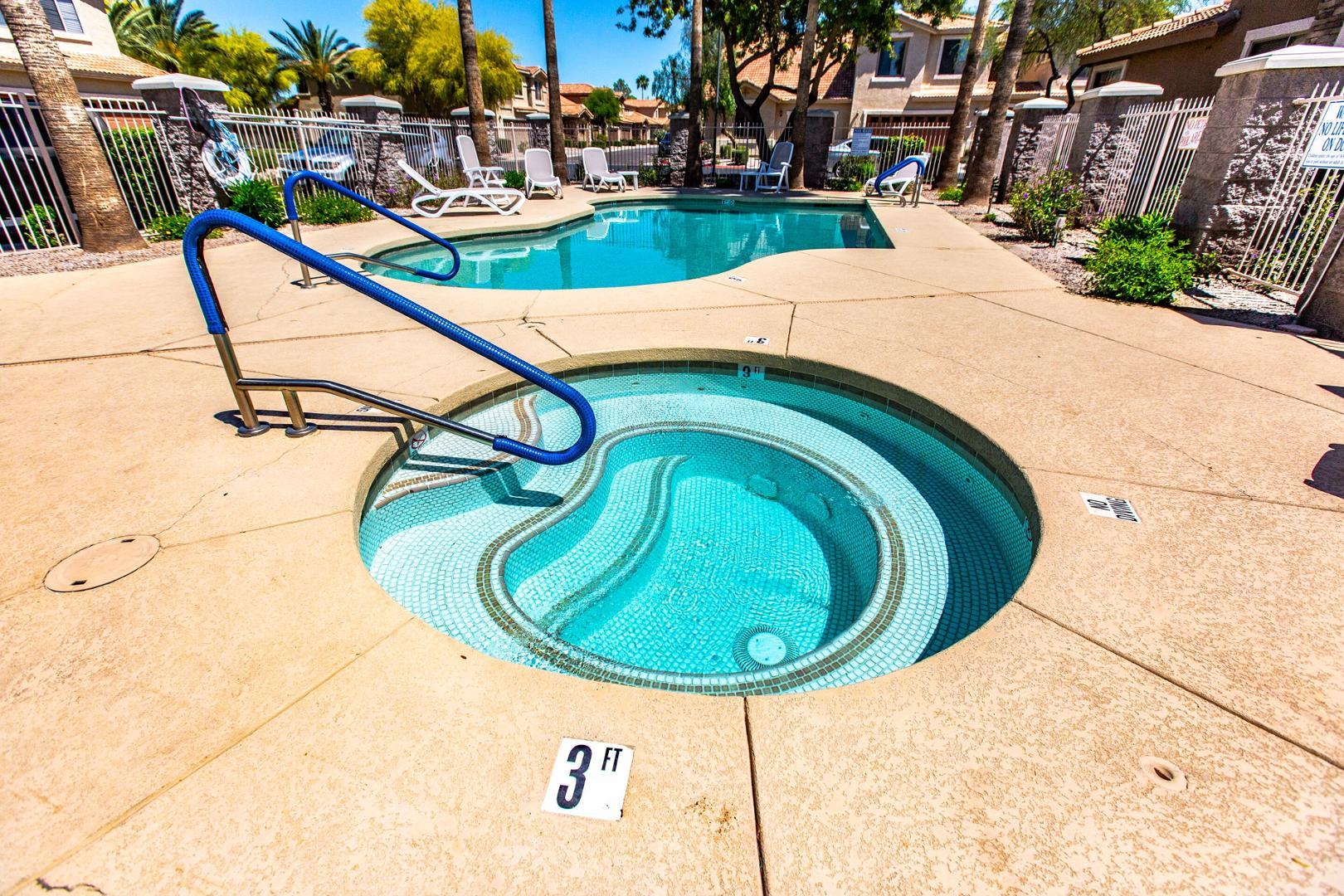 5415 East McKellips Road Mesa, AZ 85215 - Photo 12 of 14 a view of swimming pool with a tub and trees in the background
