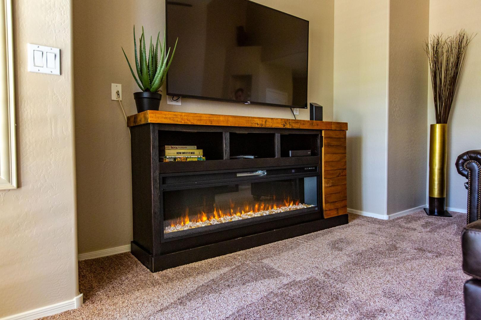 5415 East McKellips Road Mesa, AZ 85215 - Photo 3 of 14 a living room with a fireplace furniture and a potted plant