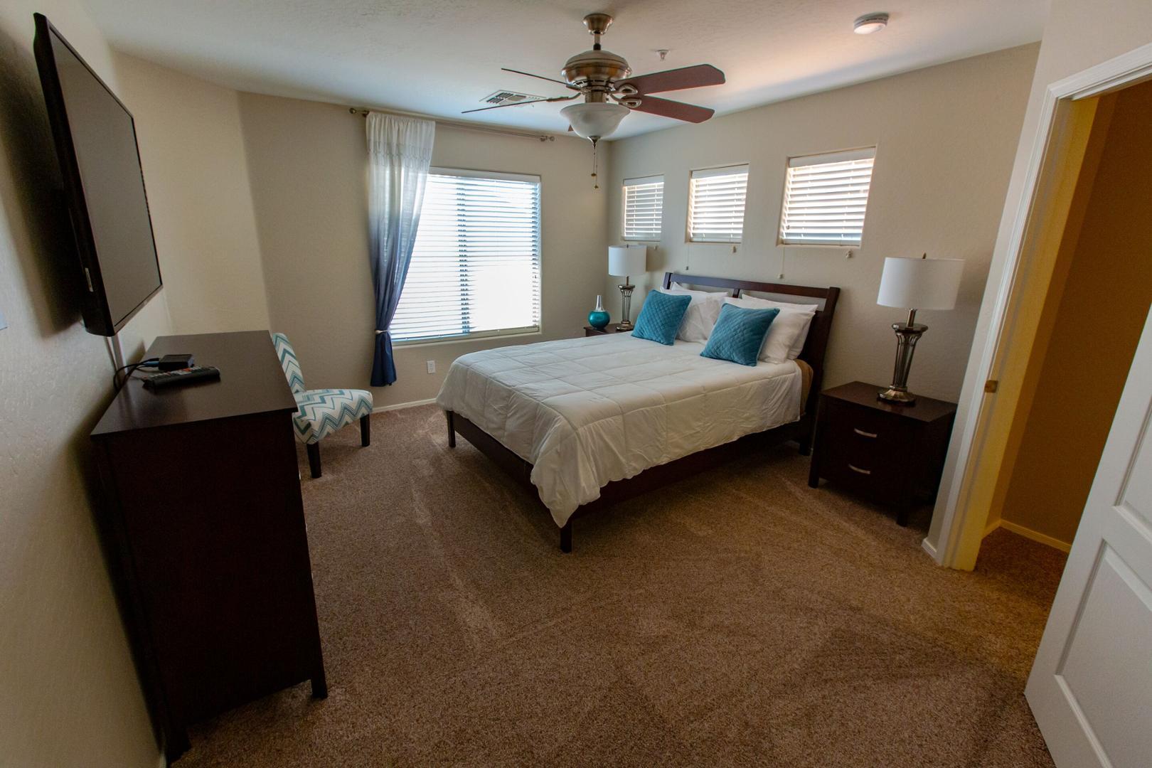 5415 East McKellips Road Mesa, AZ 85215 - Photo 10 of 14 a bedroom with a bed tv and a window