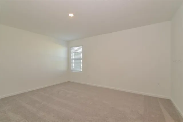 an empty room with a empty space and window