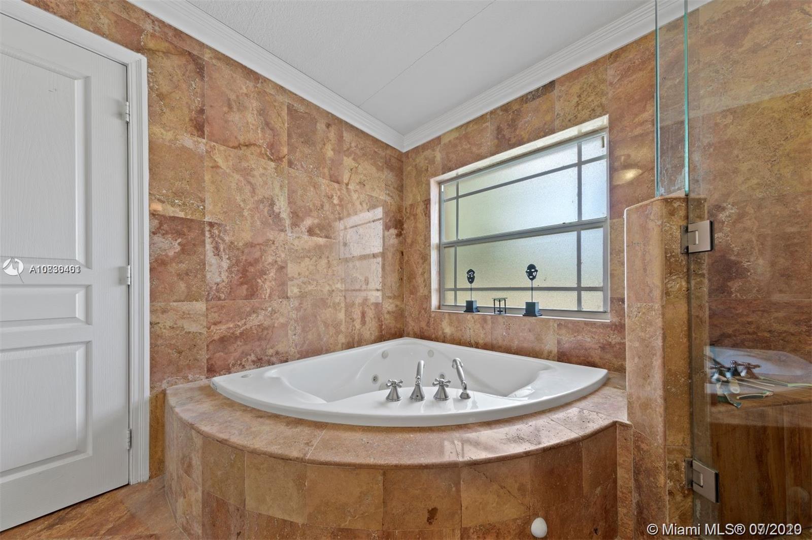 19790 Southwest 248th Street Homestead, FL 33031 - Photo 14 of 19 partial view of over sized master bath.. equip w shower large enough for 2, jacuzzi tub(SHOWN) ,dB sinks, etc.