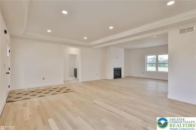 a kitchen with a stove sink and cabinets