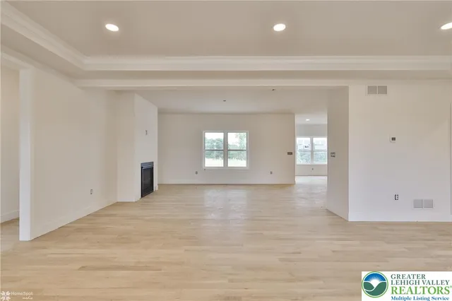 a view of a kitchen with a sink and dishwasher cabinet with wooden floor