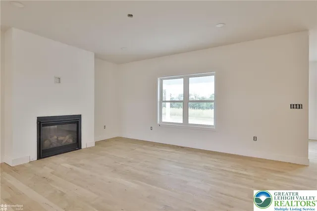 a large kitchen with a refrigerator and a sink