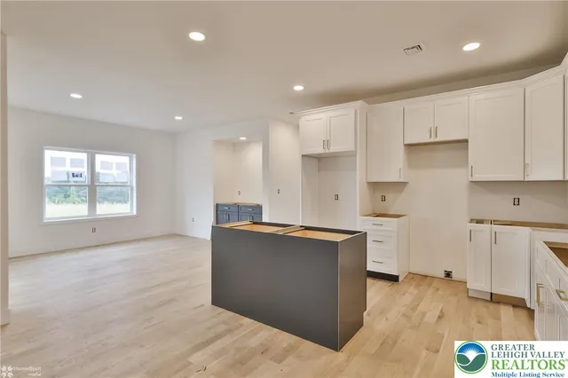 a bathroom with a bathtub sink and vanity