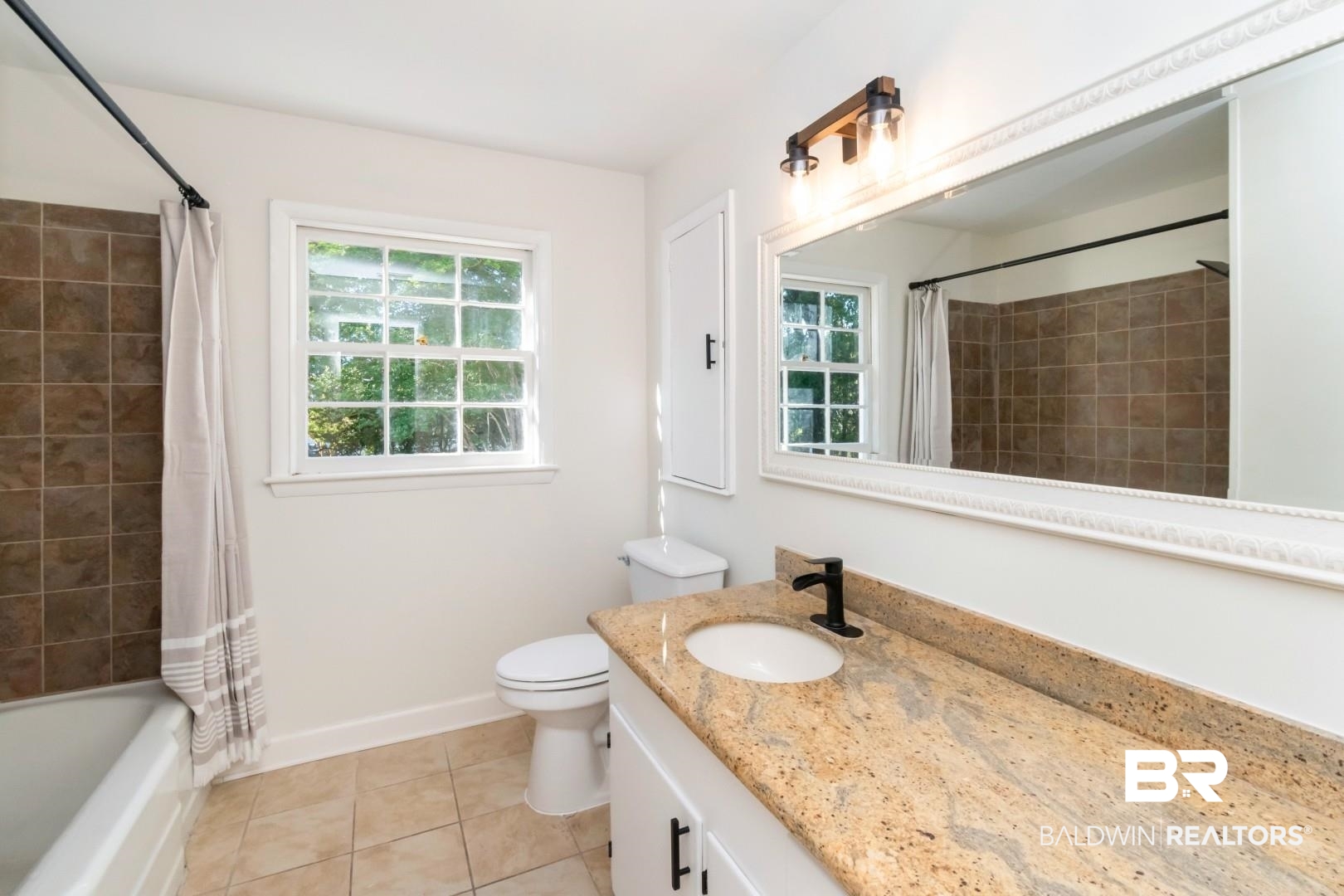 115 Pineridge Road Daphne, AL 36526 - Photo 26 of 34 Full bath with tile patterned flooring, toilet, vanity, shower / bath combo with shower curtain, and baseboards