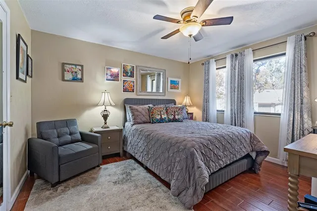 a bedroom with a bed couch and a window