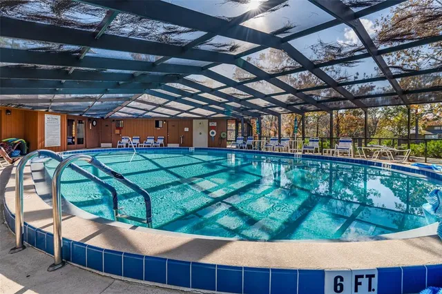 a view of a swimming pool with a patio