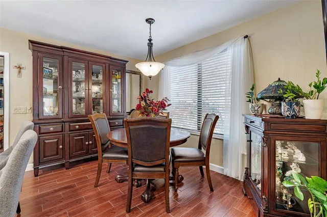 a view of a dining room with furniture window and wooden floor