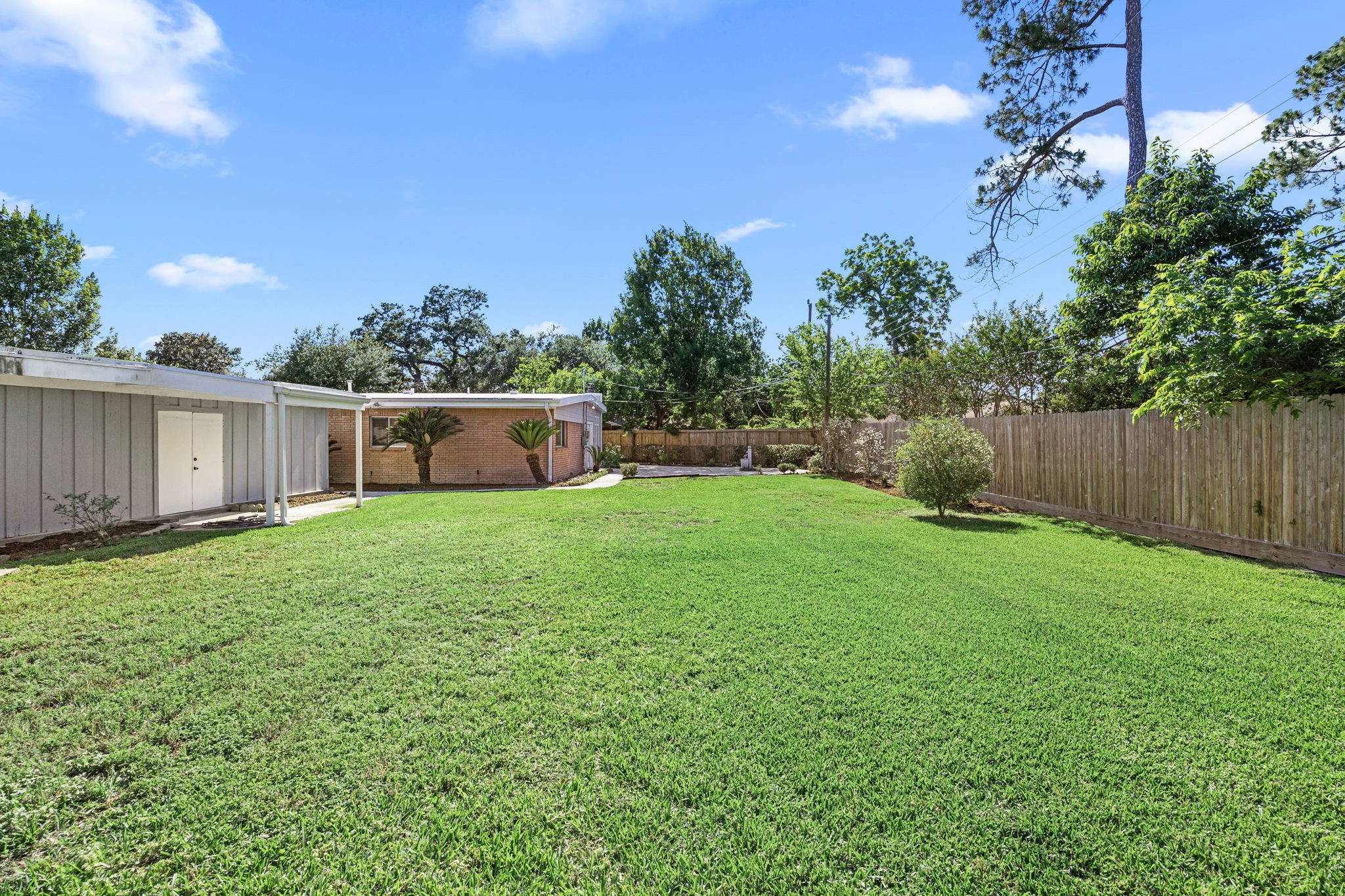 10310 Mayfield Road Houston, TX 77043 - Photo 42 of 49 Rear view - back of garage has a workshop