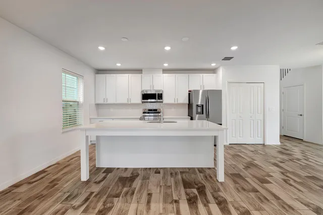 a view of kitchen with wooden floor