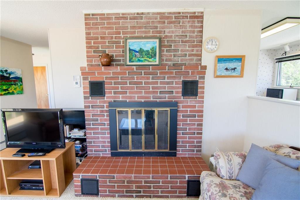 325 Ficketts Point Road Milbridge, ME 04658 - Photo 12 of 35 Main living room fire place.