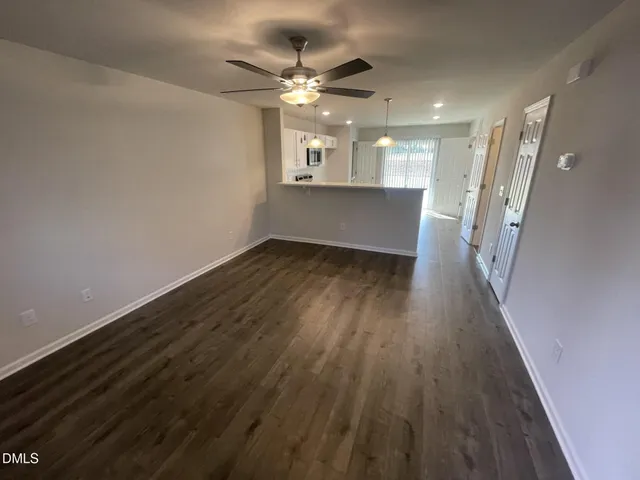 wooden floor in an empty room with a mirror