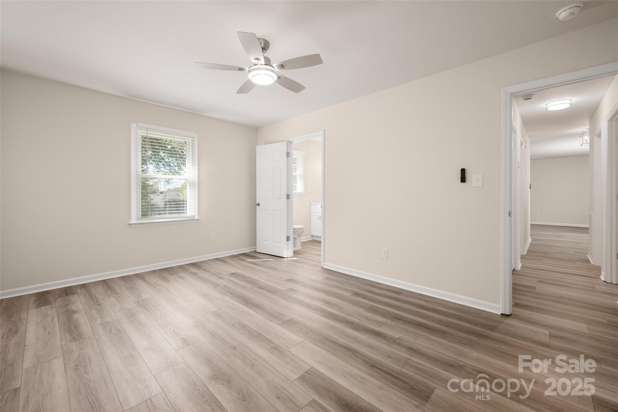 3331 Rock Hill Church Road Concord, NC 28027 - Photo 17 of 46 a view of an empty room with wooden floor and a window