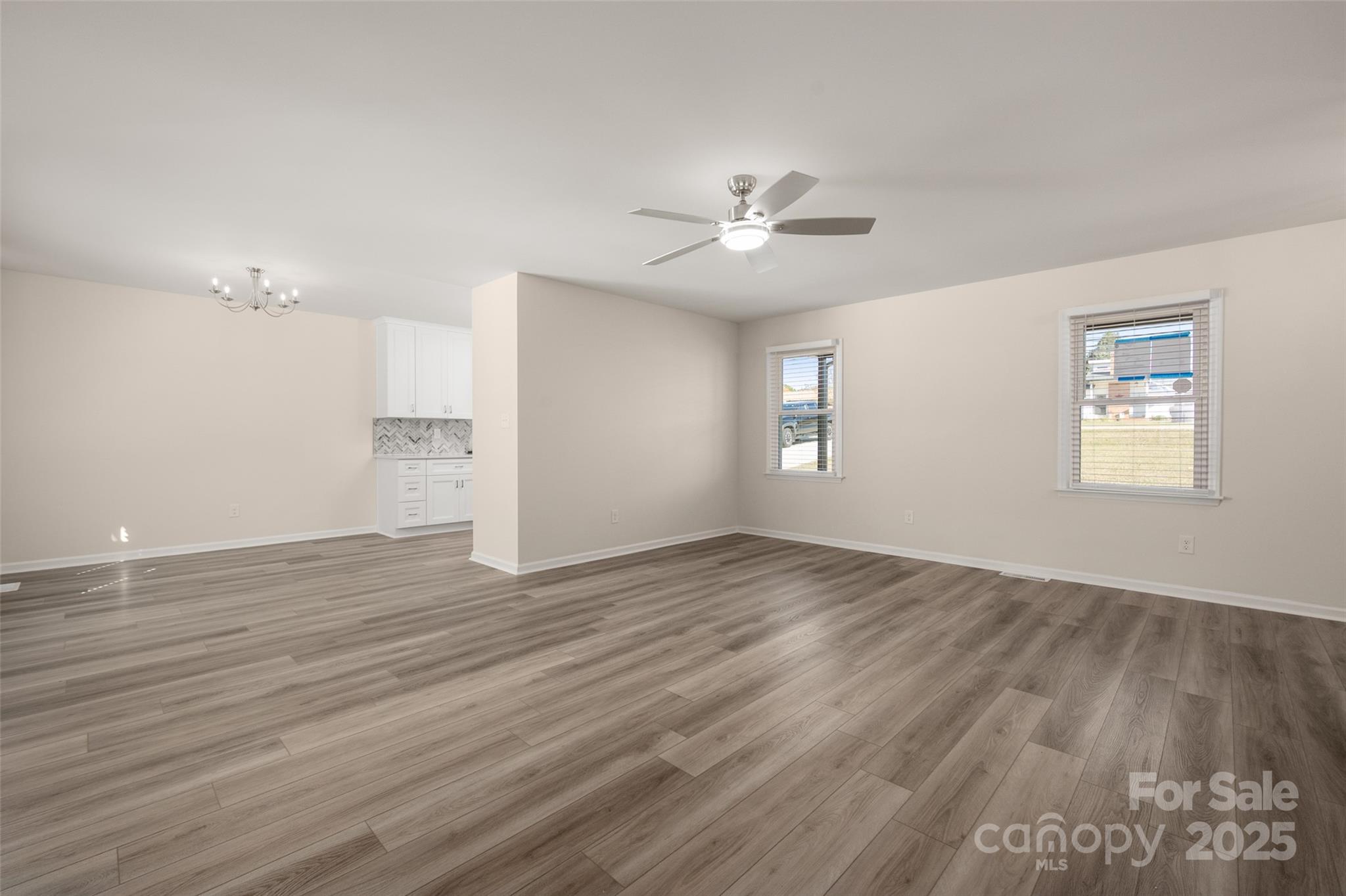 3331 Rock Hill Church Road Concord, NC 28027 - Photo 8 of 46 a view of empty room with wooden floor and fan