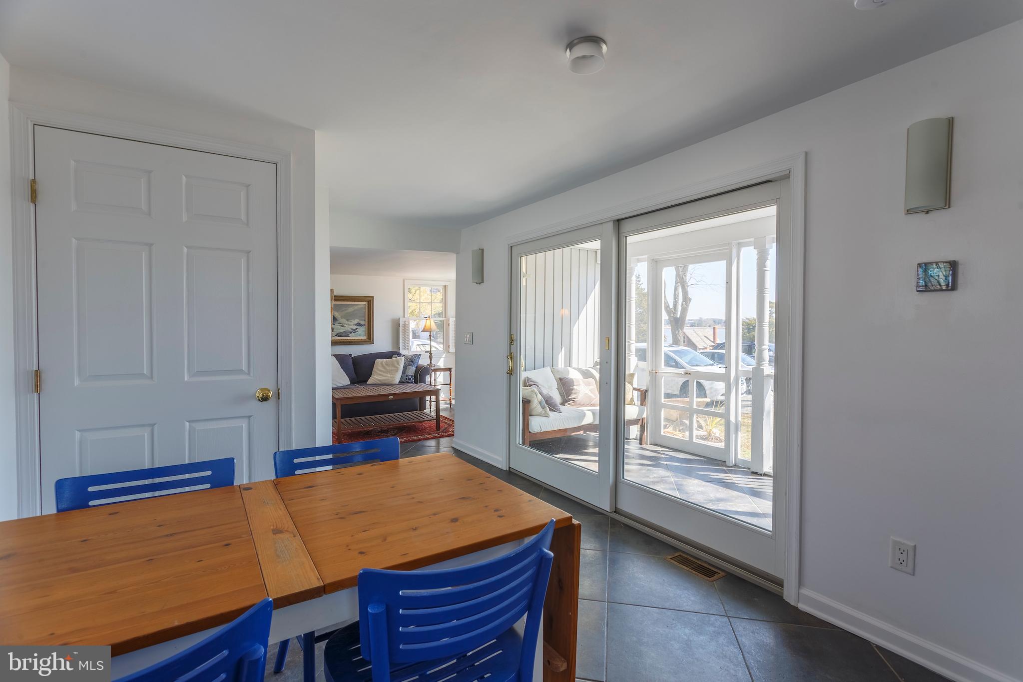 5560 Quaker Neck Landing Road Chestertown, MD 21620 - Photo 5 of 21 Dining area adjacent to a comfy screened porch