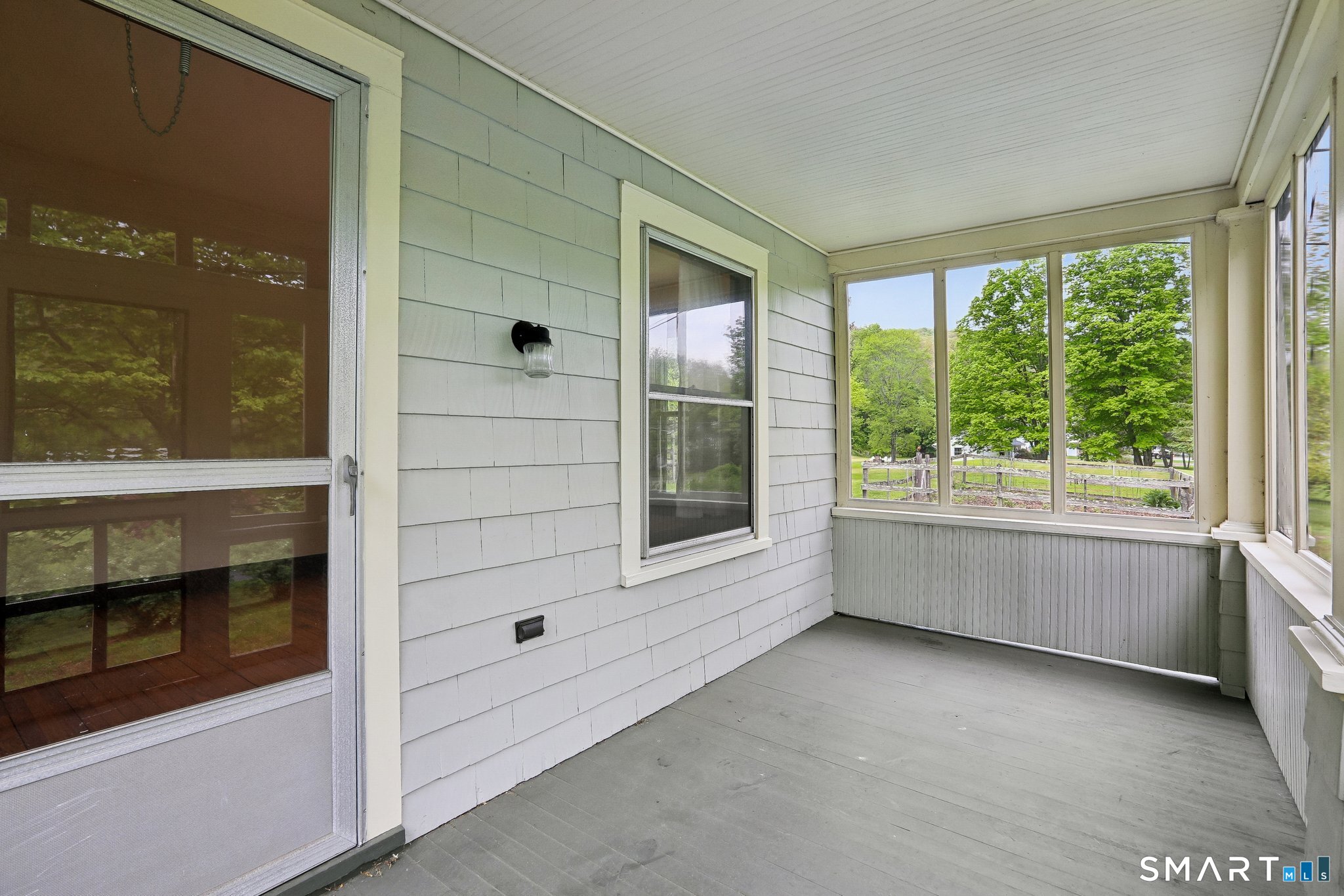 349 Litchfield Road New Milford, CT 06776 - Photo 14 of 27 a view of an empty room with a fireplace and a window