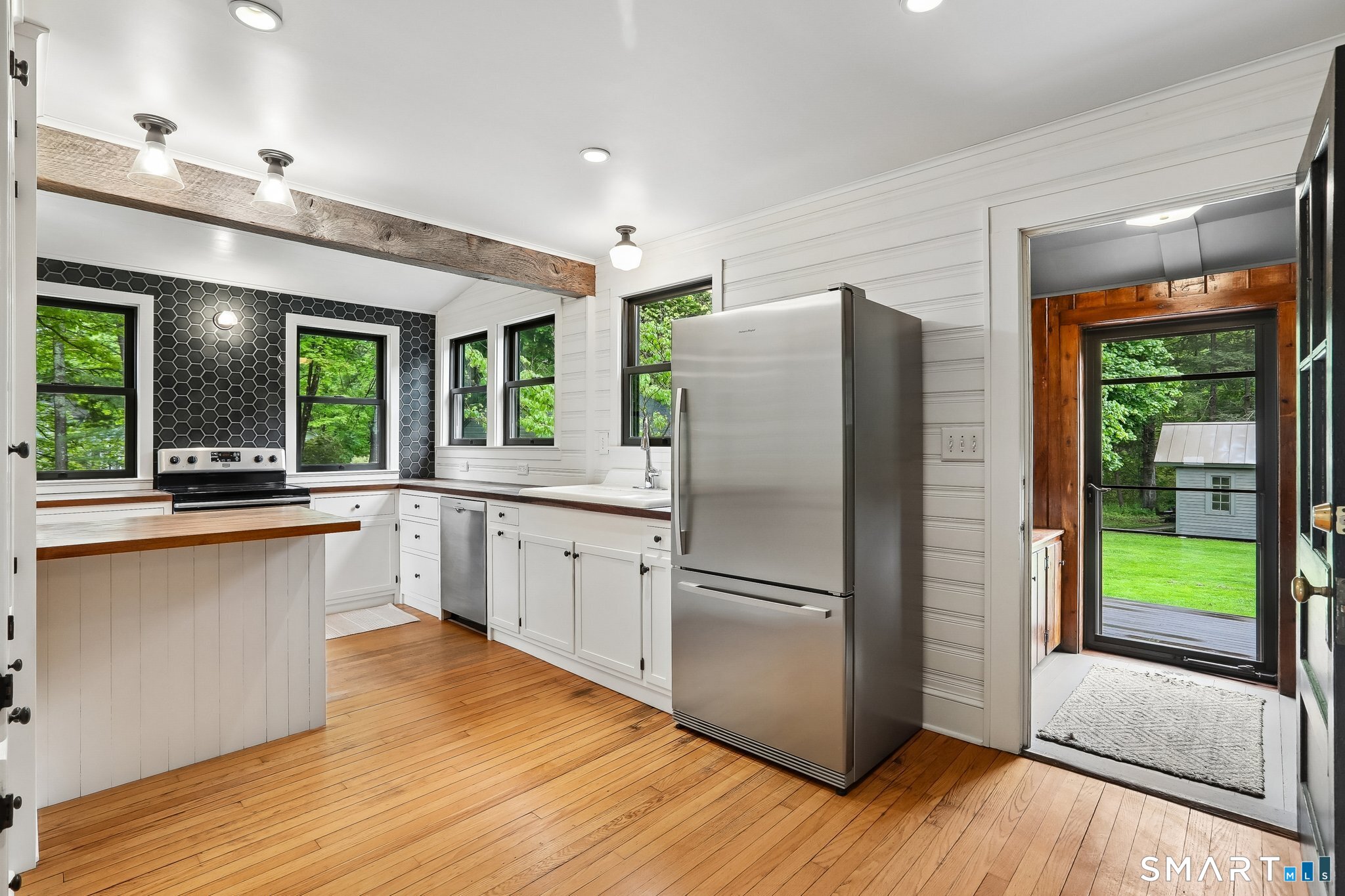 349 Litchfield Road New Milford, CT 06776 - Photo 5 of 27 a kitchen with stainless steel appliances granite countertop a refrigerator and a sink