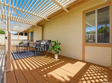 a view of a patio with wooden floor