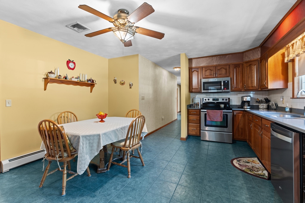 36 High Street Freetown, MA 02702 - Photo 17 of 42 a kitchen with a dining table and chairs