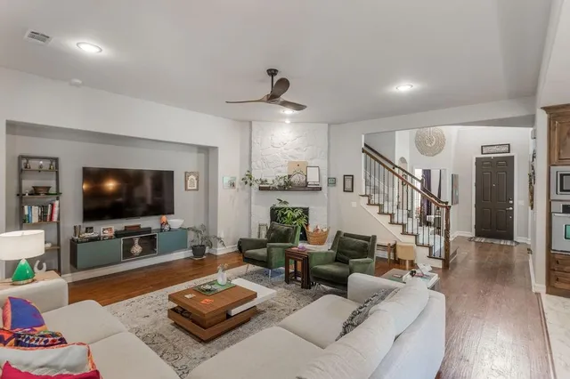 a living room with furniture and a flat screen tv