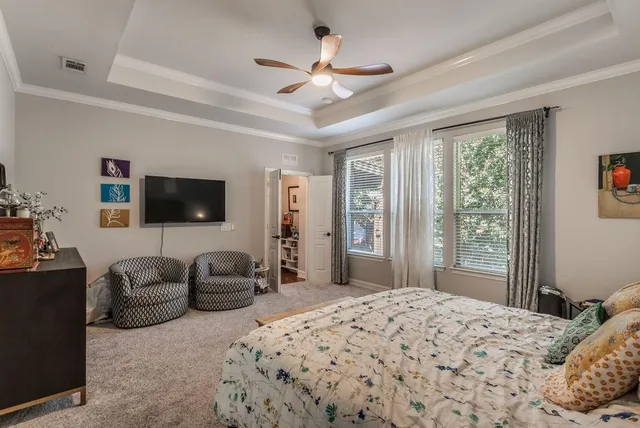 a bedroom with two beds and a window