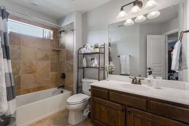 a bedroom with a bed and a book shelf