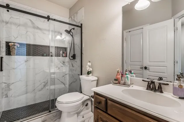 a living room with lots of furniture and book shelf