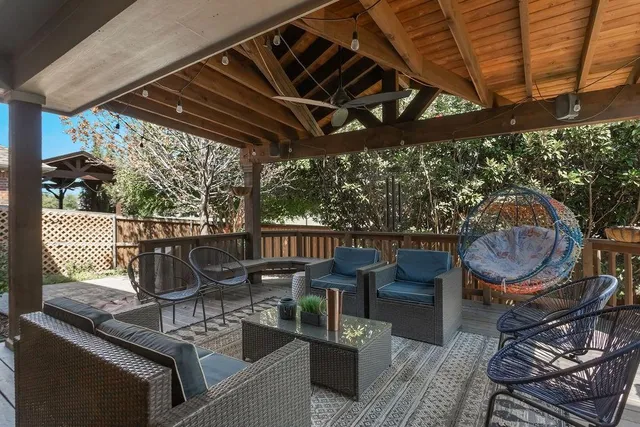 a view of an outdoor sitting area with furniture