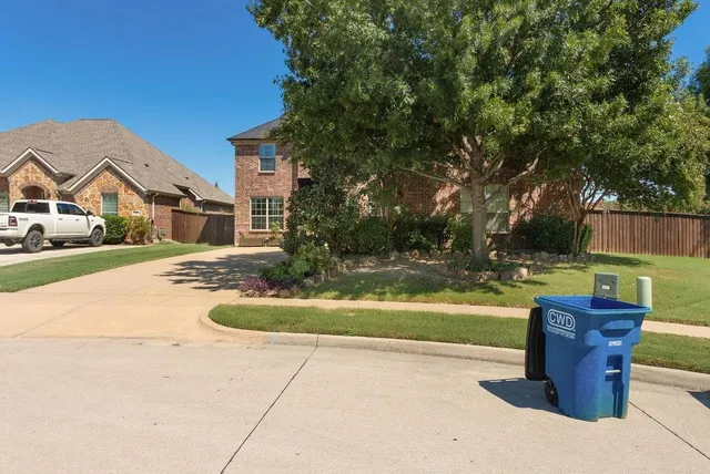 a patio with water view fountain and a potted plant