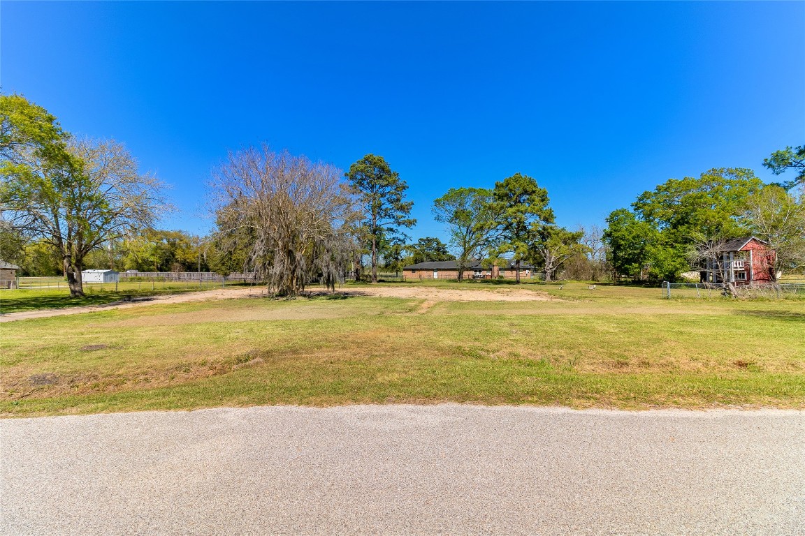 Cleared 0.93 acre residential lot in Sweeny, Texas offering an ideal homesite for a custom build in Brazoria County.
