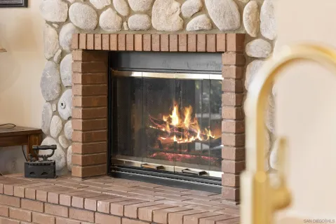 a view of fireplace with wooden floor