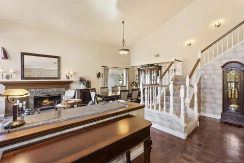 a living room with fireplace furniture and a wooden floor