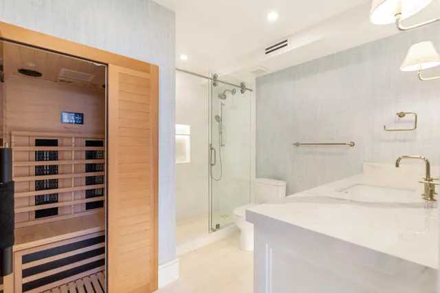 a bathroom with a shower and a sink