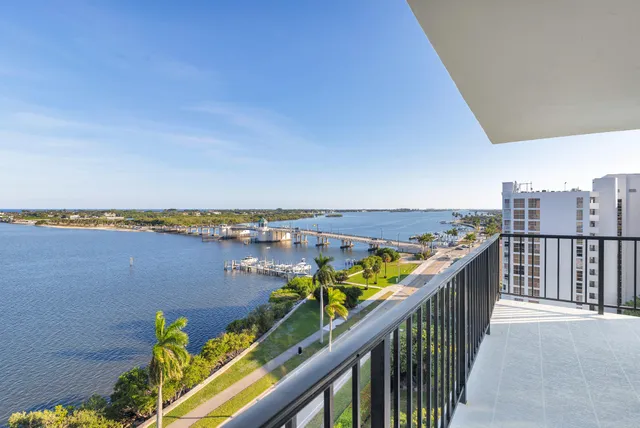a view of a balcony next to a yard