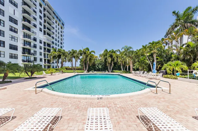 a view of a swimming pool with a lounge chairs