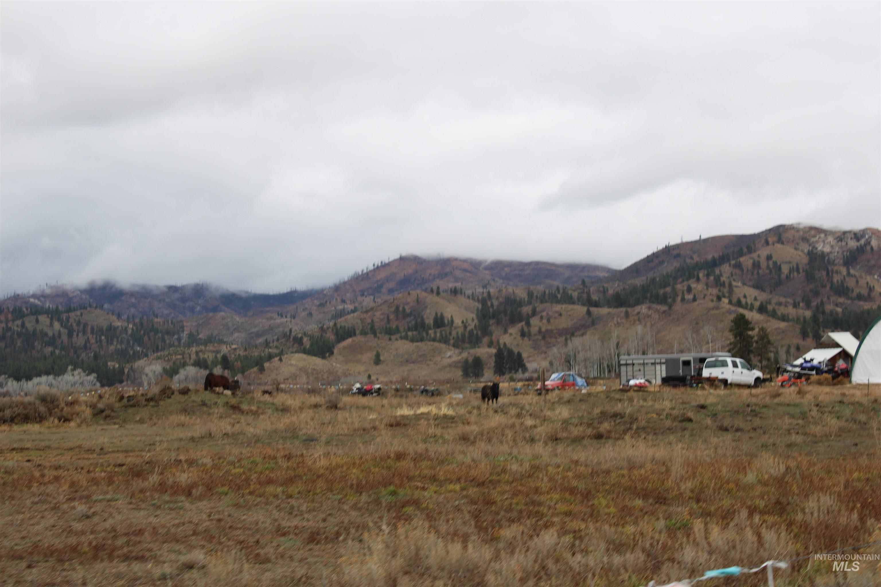 View of mountain backdrop with rural landscape