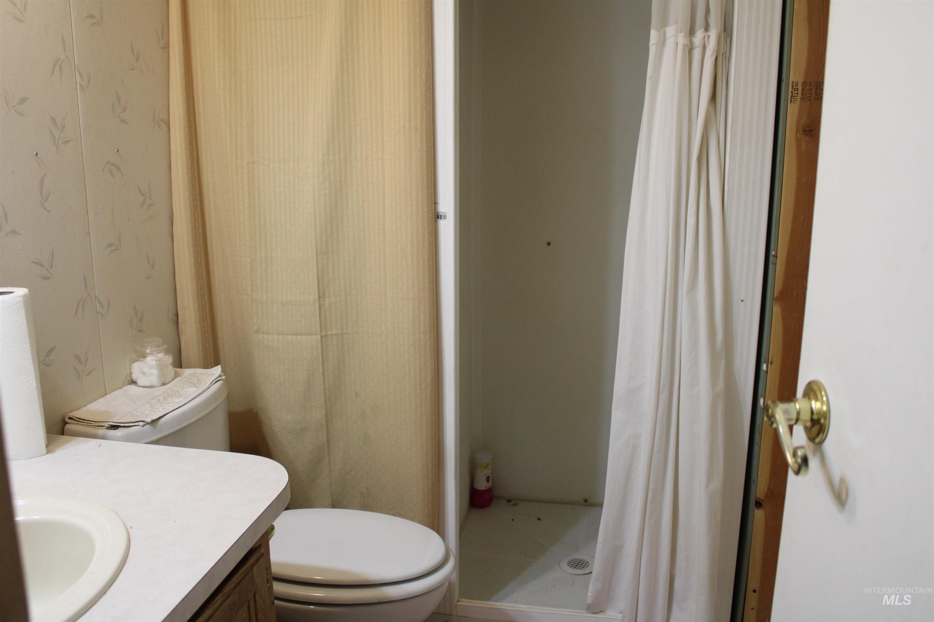 200 East Prairie Road Mountain Home, ID 83647 - Photo 17 of 38 Bathroom with a stall shower and vanity