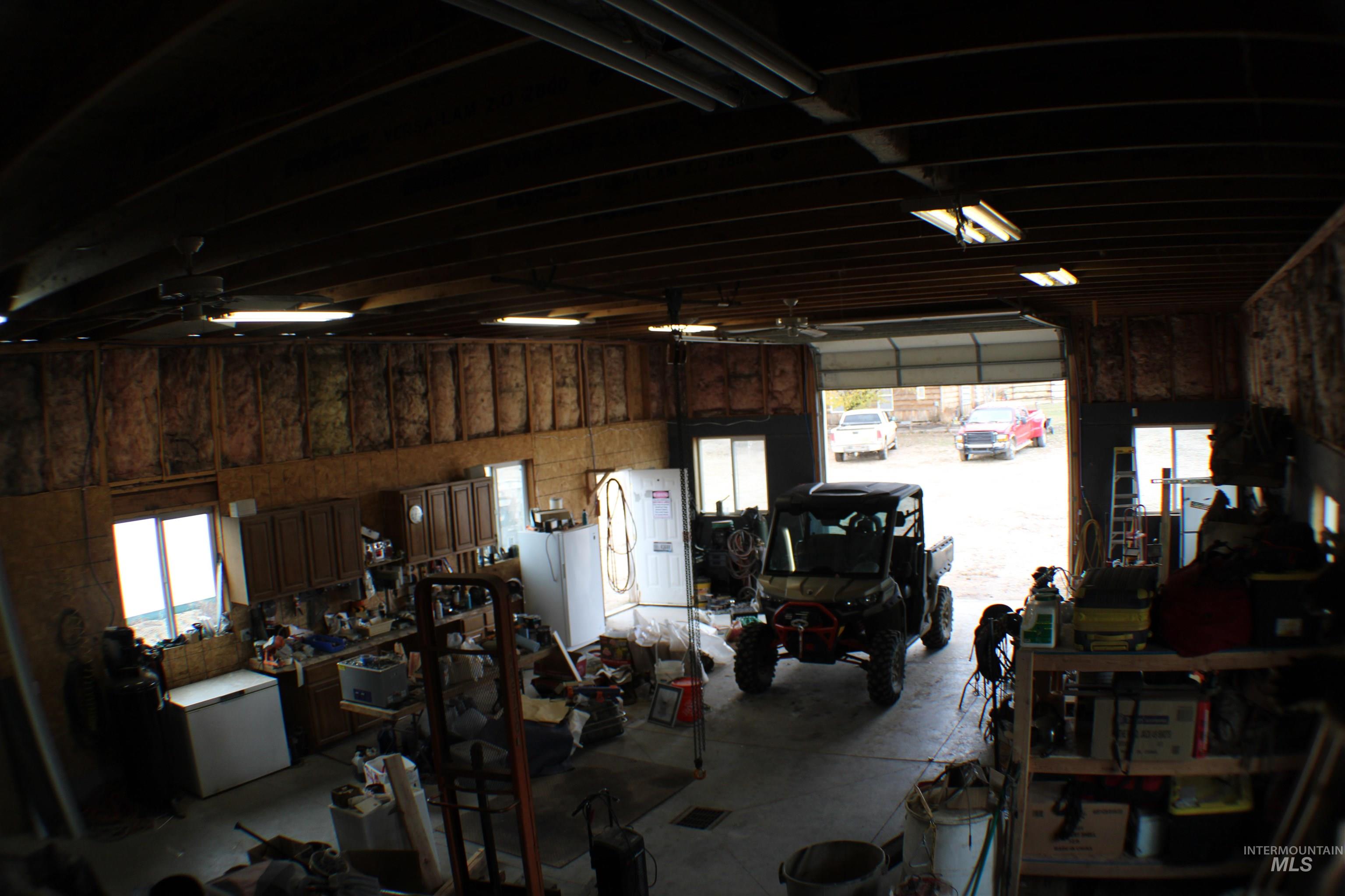 200 East Prairie Road Mountain Home, ID 83647 - Photo 33 of 38 Garage featuring a workshop area