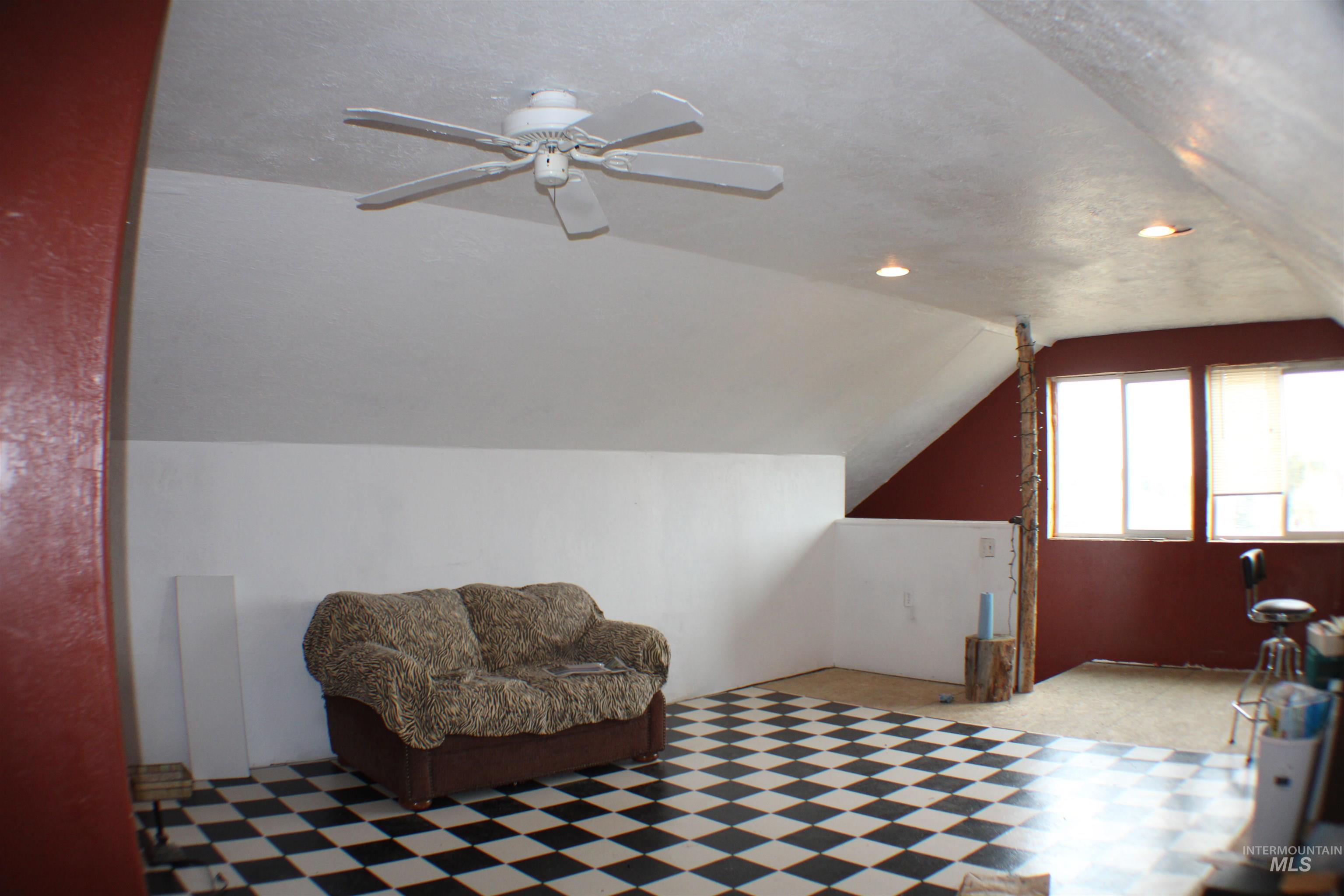 200 East Prairie Road Mountain Home, ID 83647 - Photo 38 of 38 Bonus room featuring lofted ceiling, tile patterned floors, ceiling fan, a textured ceiling, and recessed lighting