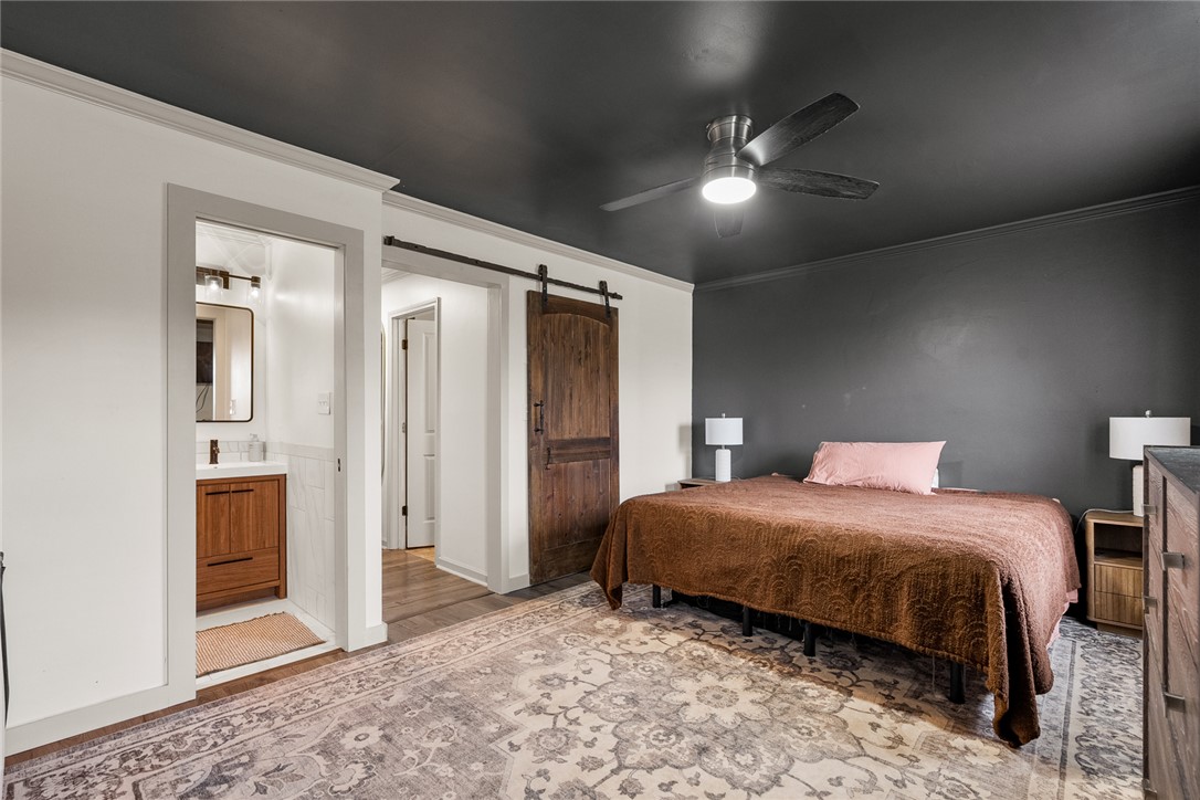 4508 Old Williamston Road Belton, SC 29627 - Photo 14 of 47 This serene bedroom offers a tranquil retreat with convenient access to an adjacent bathroom.