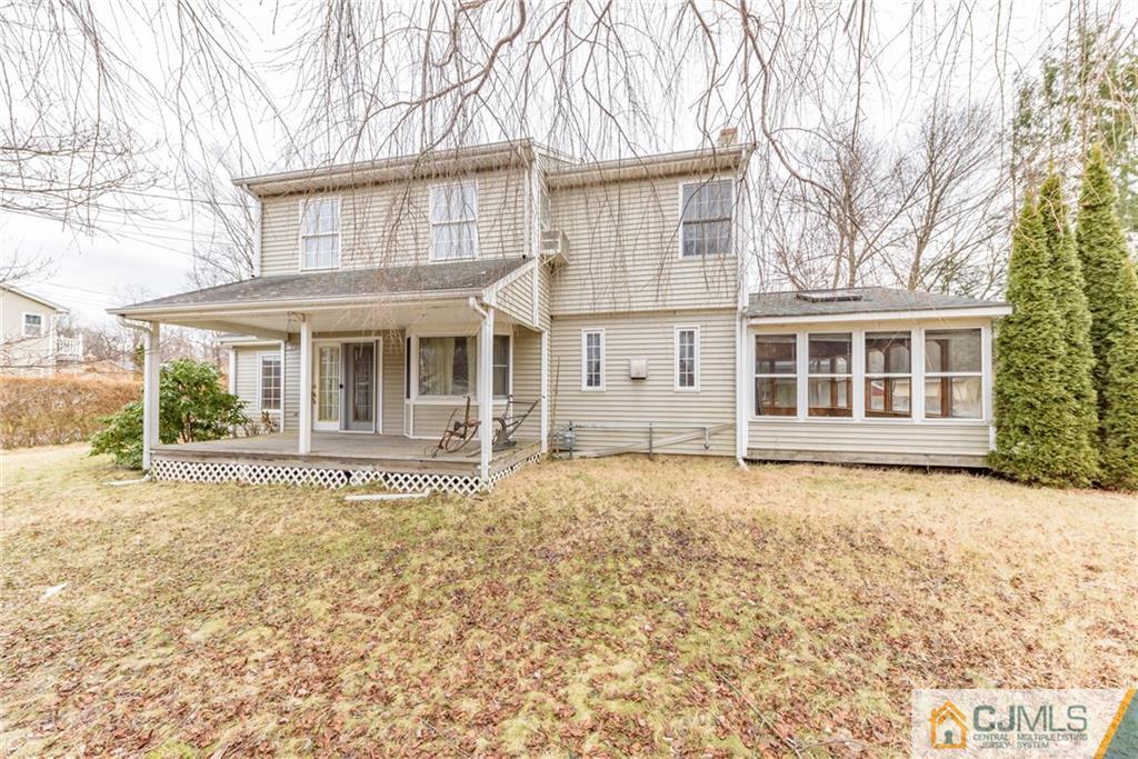 26 Moquis Trail Oak Ridge, NJ 07438 - Photo 1 of 23 front view of a house with a yard