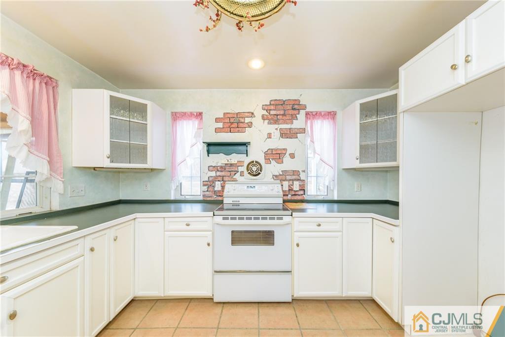 26 Moquis Trail Oak Ridge, NJ 07438 - Photo 11 of 23 a kitchen with cabinets appliances and a counter space