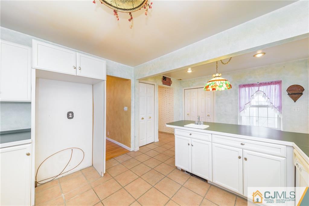 26 Moquis Trail Oak Ridge, NJ 07438 - Photo 12 of 23 a spacious bathroom with a double vanity sink a mirror and a shower