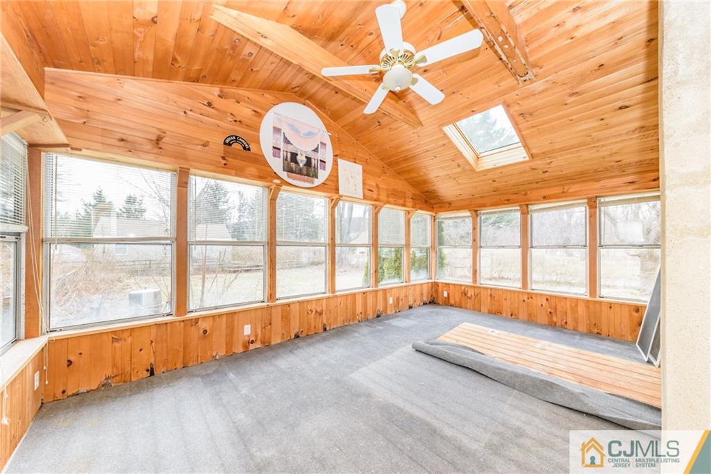 26 Moquis Trail Oak Ridge, NJ 07438 - Photo 13 of 23 a view of an empty room with a large window