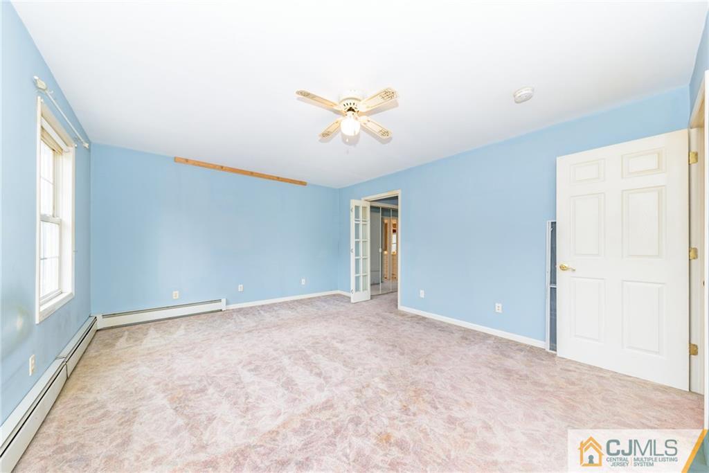 26 Moquis Trail Oak Ridge, NJ 07438 - Photo 15 of 23 a view of an empty room with a window