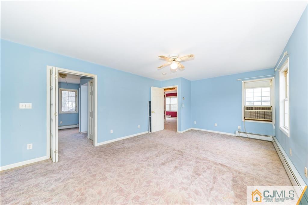 26 Moquis Trail Oak Ridge, NJ 07438 - Photo 16 of 23 an empty room with windows and closet