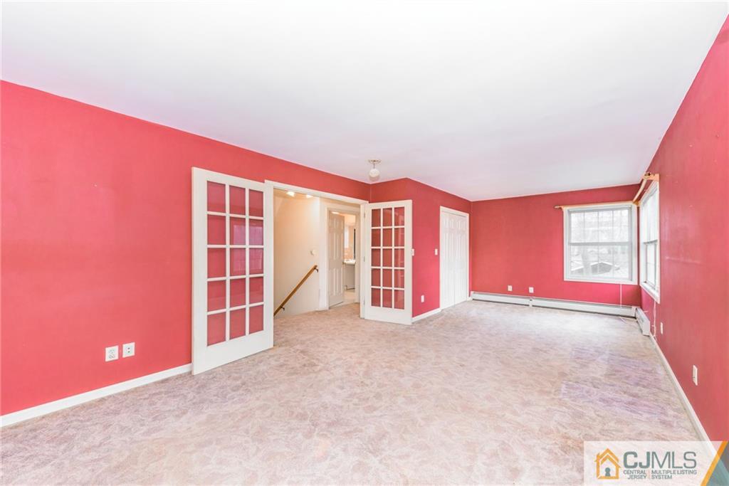 26 Moquis Trail Oak Ridge, NJ 07438 - Photo 18 of 23 an empty room with windows